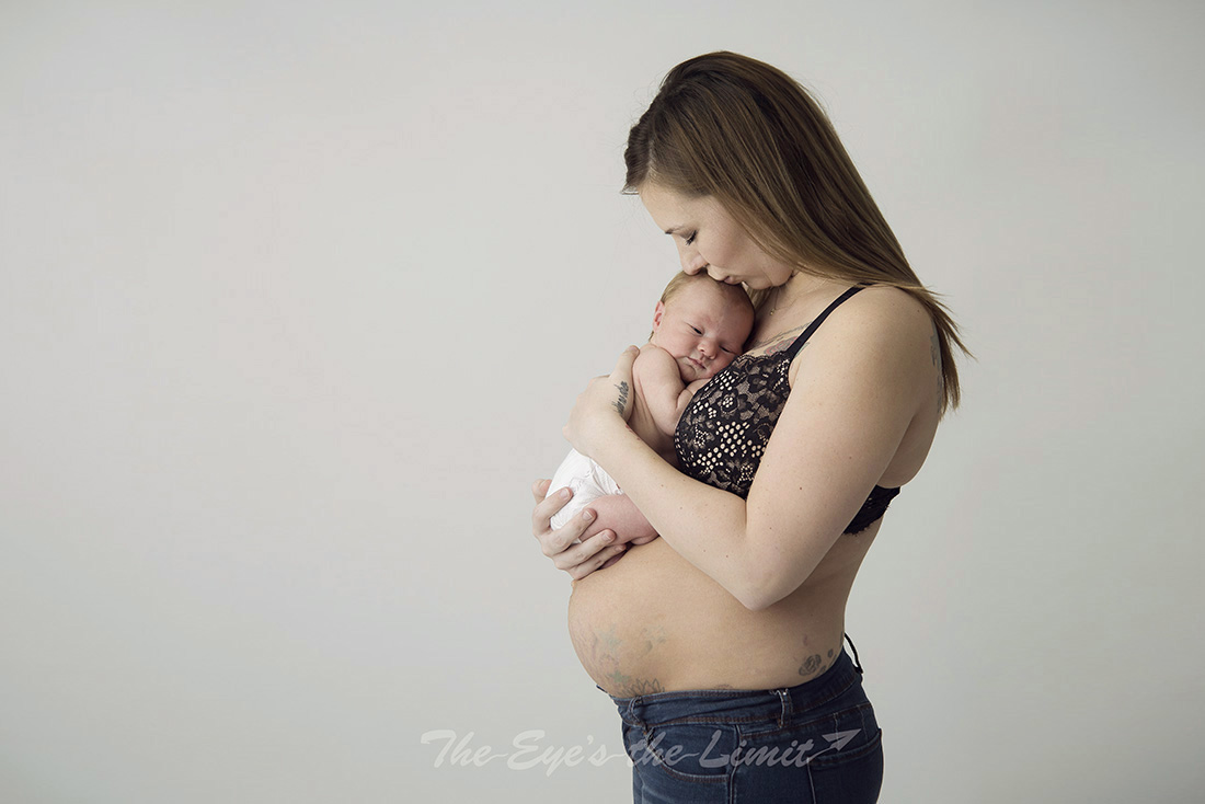 New Mom and Newborn Baby with Mom showing post baby belly